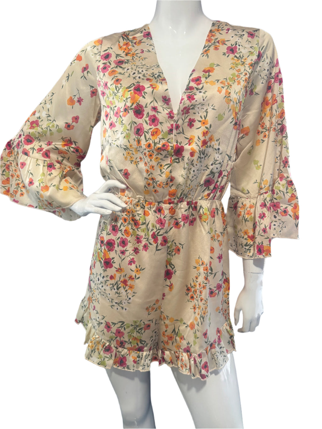 Floral dress on a mannequin against a dark background